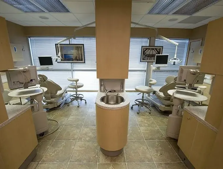 Two treatment bays, each with its own window.