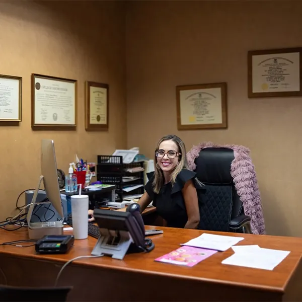 A member of our team at her desk in the practice office.