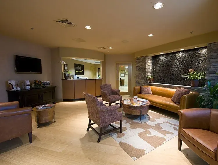 The lobby, with the stone feature wall and leather seating.