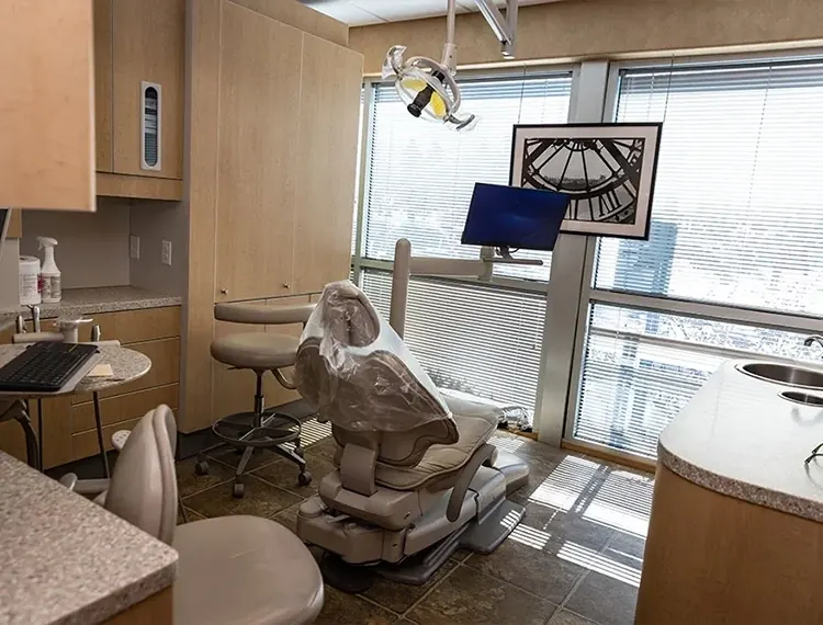 A treatment room at Main Line Dental Group, with the chair by a window.